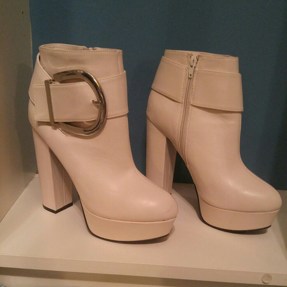 Off white ankle boots with silver buckle